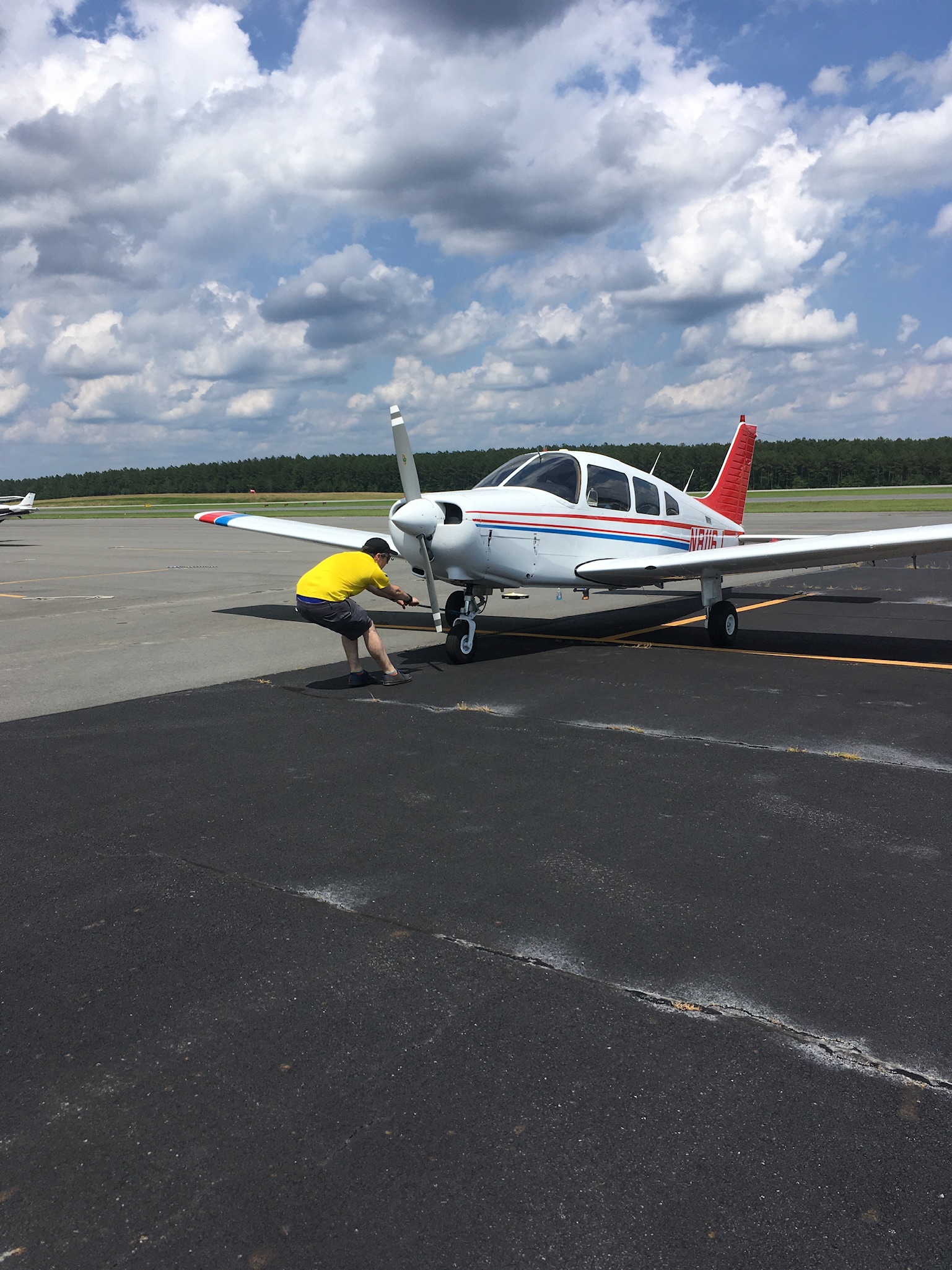 Tyrel pulling the plane forward, to get it lined up to push back for parking.