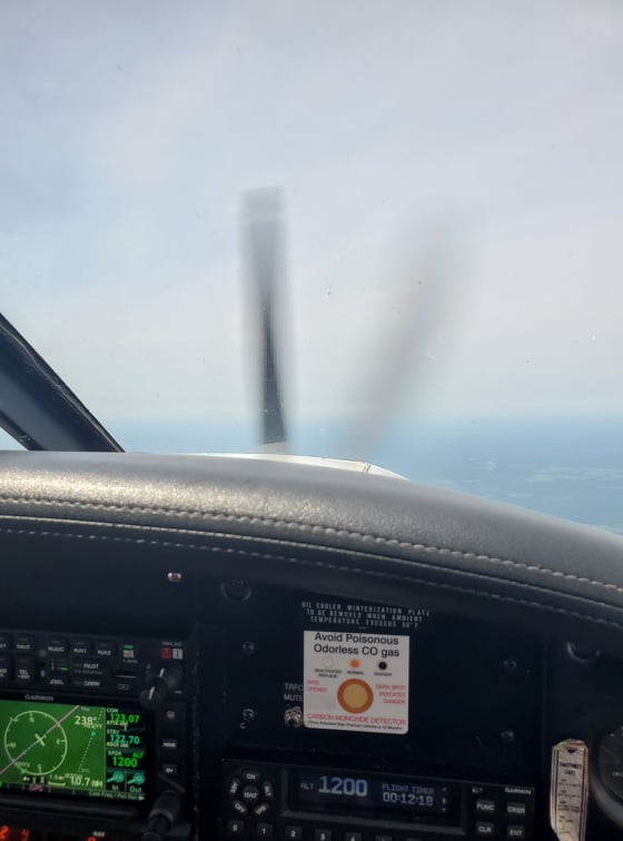 Part of the dashboard, and CO detector, plus a blurry propeller in the background