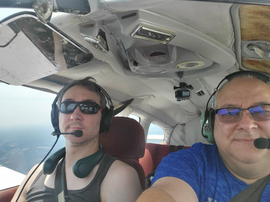 Me and Dad sitting in airplane, somewhere above North Carolina
