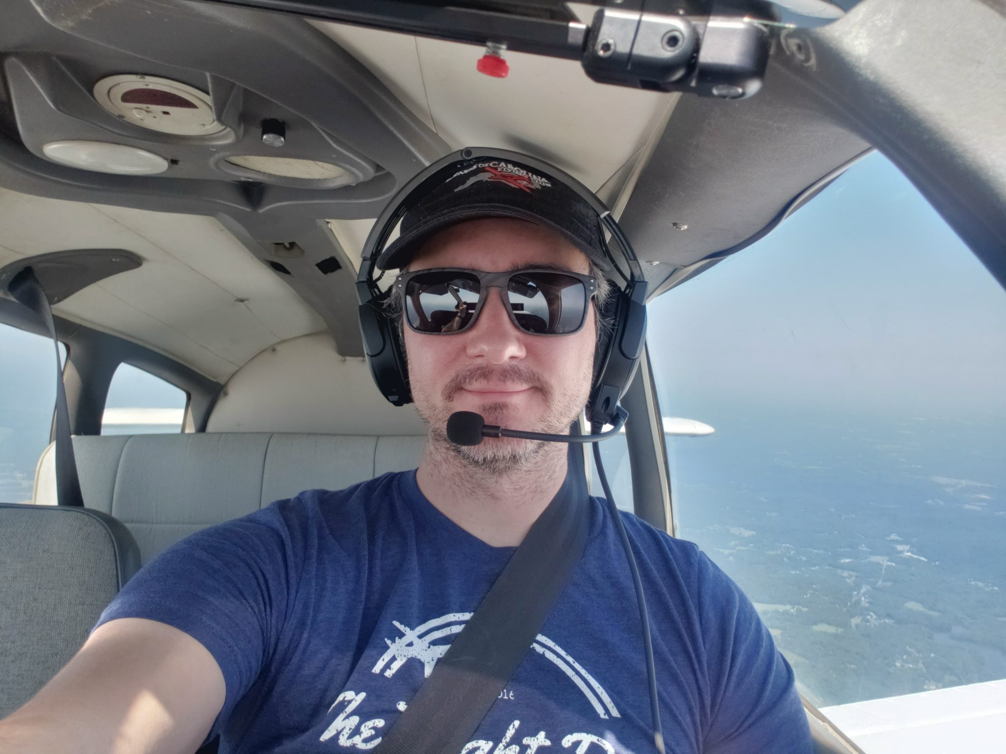 Selfie in the cockpit, me wearing a blue shirt.