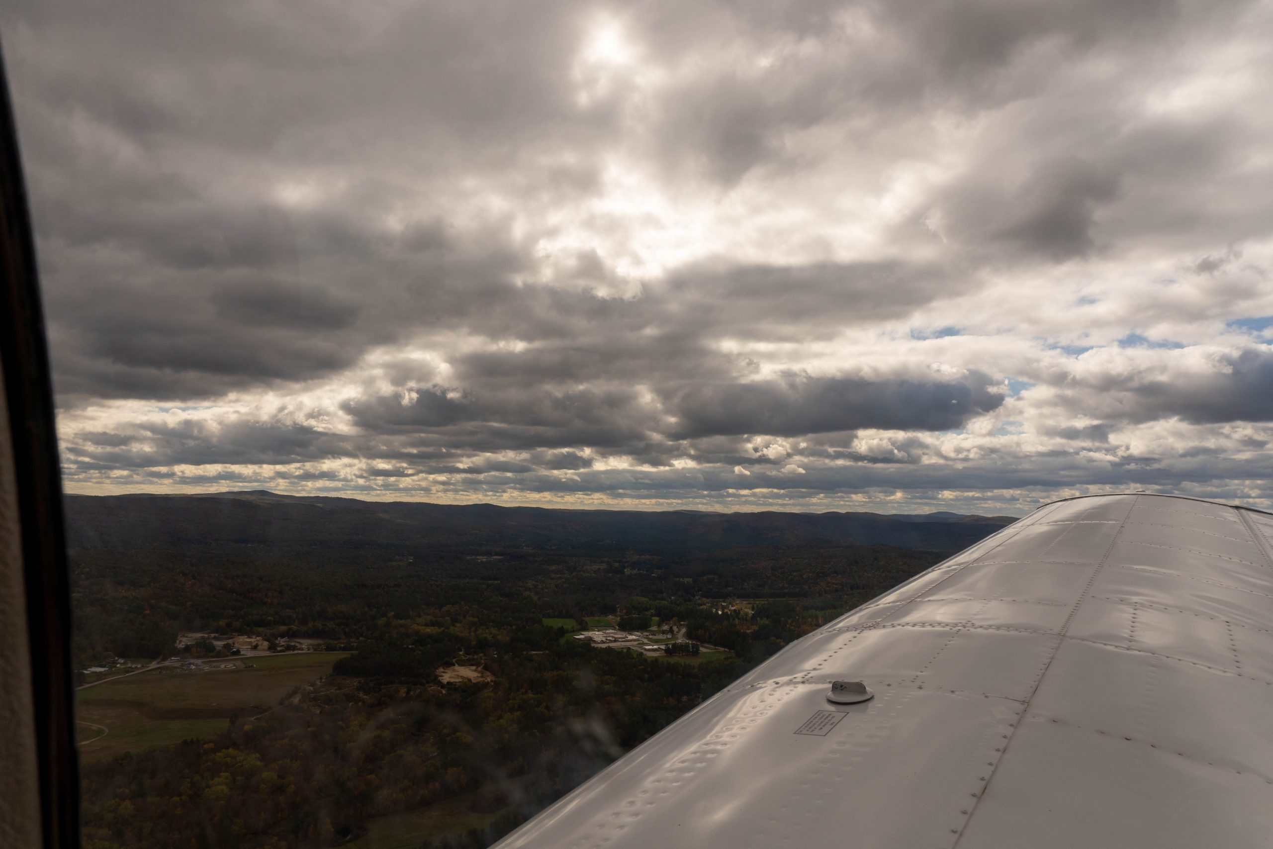 Cloudy and Sunny View off the right wing. Monadnock in the distance.