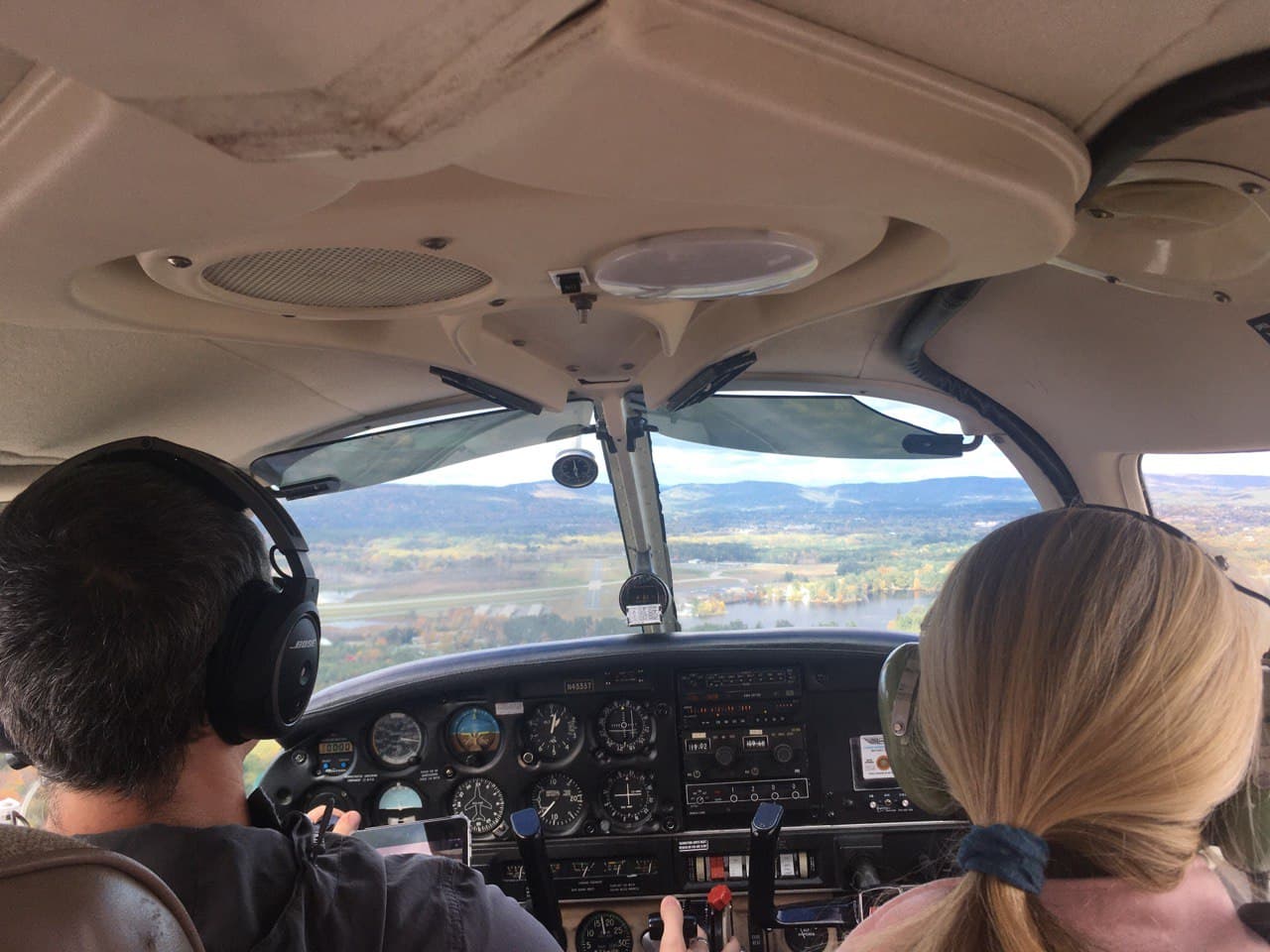 Cockpit view, a mile out from runway 32/14 with the runway in sight.