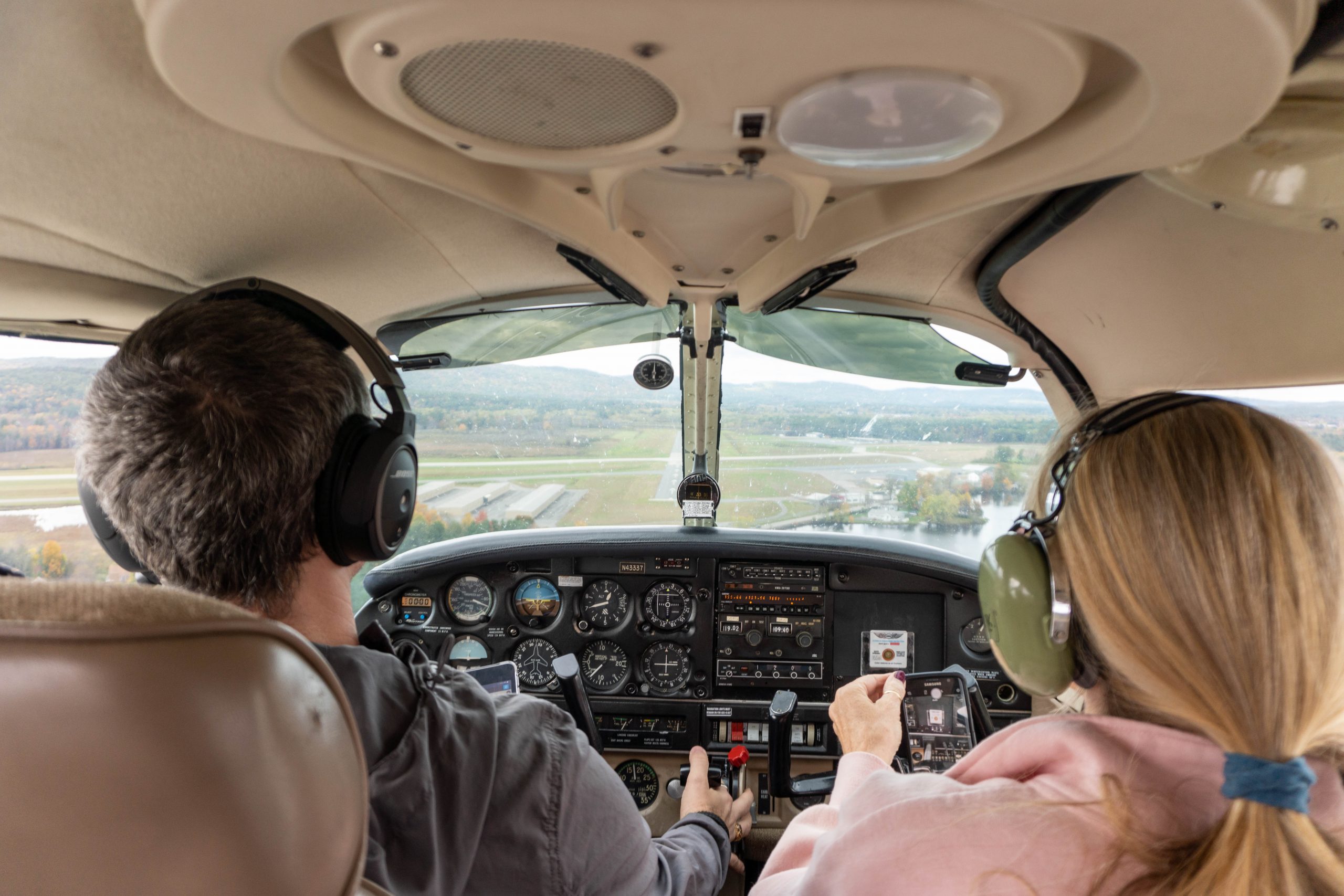 Cockpit view, a 1/4 mile from runway 32/14 with the runway in sight.